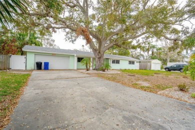 This home lies amongst water front estates on the beautiful on The Dunedin Country Club in Florida - for sale on GolfHomes.com, golf home, golf lot