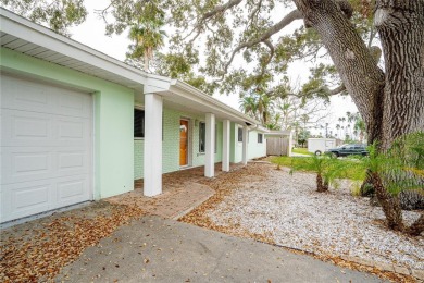 This home lies amongst water front estates on the beautiful on The Dunedin Country Club in Florida - for sale on GolfHomes.com, golf home, golf lot