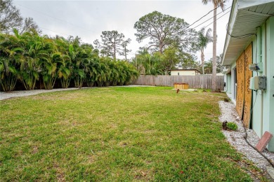 This home lies amongst water front estates on the beautiful on The Dunedin Country Club in Florida - for sale on GolfHomes.com, golf home, golf lot