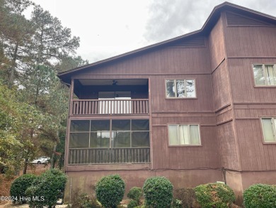 Top-floor condo with stunning views of the 8th hole at Highland on Hyland Golf Club in North Carolina - for sale on GolfHomes.com, golf home, golf lot