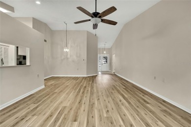 This charming villa, located on the first hole of the Grand on Timber Pines Golf Course in Florida - for sale on GolfHomes.com, golf home, golf lot