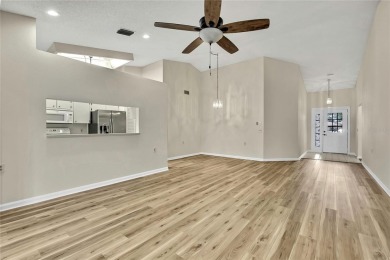 This charming villa, located on the first hole of the Grand on Timber Pines Golf Course in Florida - for sale on GolfHomes.com, golf home, golf lot