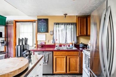 With some TLC, this home could shine again--but the best part? on The Hideout Golf in Pennsylvania - for sale on GolfHomes.com, golf home, golf lot