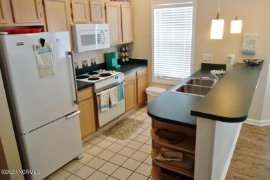 Beautifully furnished condo in Sea Trail Plantation with a golf on Sea Trail Golf Resort in North Carolina - for sale on GolfHomes.com, golf home, golf lot