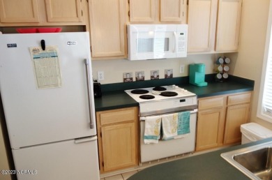 Beautifully furnished condo in Sea Trail Plantation with a golf on Sea Trail Golf Resort in North Carolina - for sale on GolfHomes.com, golf home, golf lot