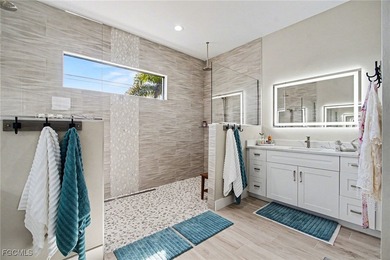 Welcome to your dream oasis! This stunning 3-bedroom, plus den on Palmetto-Pine Country Club in Florida - for sale on GolfHomes.com, golf home, golf lot