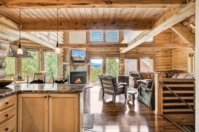 This log home comes fully furnished and is a true mountain on Raven Golf Club At Three Peaks in Colorado - for sale on GolfHomes.com, golf home, golf lot