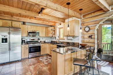 This log home comes fully furnished and is a true mountain on Raven Golf Club At Three Peaks in Colorado - for sale on GolfHomes.com, golf home, golf lot