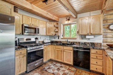 This log home comes fully furnished and is a true mountain on Raven Golf Club At Three Peaks in Colorado - for sale on GolfHomes.com, golf home, golf lot