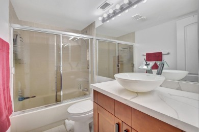 This stunning first-floor condo offers a spacious and modern on Boca Pointe Country Club in Florida - for sale on GolfHomes.com, golf home, golf lot