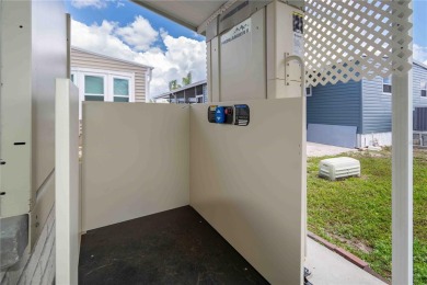 Florida Living at Its Finest in Sought-After Americana Cove - on Mangrove Bay Golf Course in Florida - for sale on GolfHomes.com, golf home, golf lot