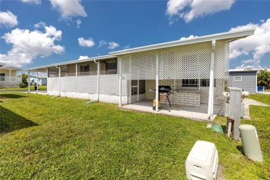 Florida Living at Its Finest in Sought-After Americana Cove - on Mangrove Bay Golf Course in Florida - for sale on GolfHomes.com, golf home, golf lot