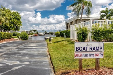 Florida Living at Its Finest in Sought-After Americana Cove - on Mangrove Bay Golf Course in Florida - for sale on GolfHomes.com, golf home, golf lot
