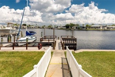 Florida Living at Its Finest in Sought-After Americana Cove - on Mangrove Bay Golf Course in Florida - for sale on GolfHomes.com, golf home, golf lot