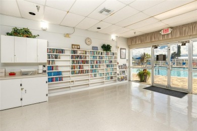 Florida Living at Its Finest in Sought-After Americana Cove - on Mangrove Bay Golf Course in Florida - for sale on GolfHomes.com, golf home, golf lot