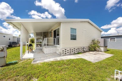 Florida Living at Its Finest in Sought-After Americana Cove - on Mangrove Bay Golf Course in Florida - for sale on GolfHomes.com, golf home, golf lot