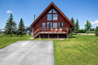 This charming Cedar log cabin is located on a scenic corner lot on Star Valley RV Golf Course in Wyoming - for sale on GolfHomes.com, golf home, golf lot