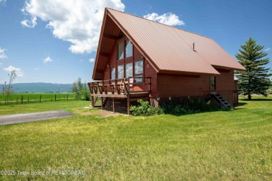 This charming Cedar log cabin is located on a scenic corner lot on Star Valley RV Golf Course in Wyoming - for sale on GolfHomes.com, golf home, golf lot