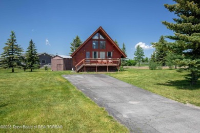 This charming Cedar log cabin is located on a scenic corner lot on Star Valley RV Golf Course in Wyoming - for sale on GolfHomes.com, golf home, golf lot