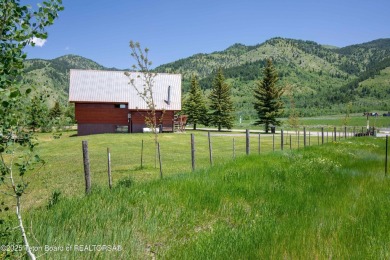 This charming Cedar log cabin is located on a scenic corner lot on Star Valley RV Golf Course in Wyoming - for sale on GolfHomes.com, golf home, golf lot