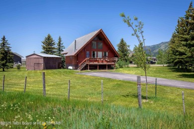 This charming Cedar log cabin is located on a scenic corner lot on Star Valley RV Golf Course in Wyoming - for sale on GolfHomes.com, golf home, golf lot