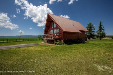 This charming Cedar log cabin is located on a scenic corner lot on Star Valley RV Golf Course in Wyoming - for sale on GolfHomes.com, golf home, golf lot