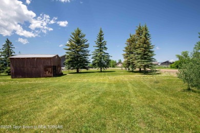 This charming Cedar log cabin is located on a scenic corner lot on Star Valley RV Golf Course in Wyoming - for sale on GolfHomes.com, golf home, golf lot