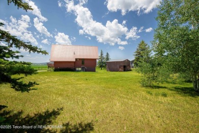 This charming Cedar log cabin is located on a scenic corner lot on Star Valley RV Golf Course in Wyoming - for sale on GolfHomes.com, golf home, golf lot