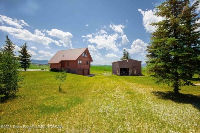 This charming Cedar log cabin is located on a scenic corner lot on Star Valley RV Golf Course in Wyoming - for sale on GolfHomes.com, golf home, golf lot