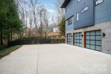 This contemporary masterpiece is nestled into one of North on Grove Park Golf and Country Club in North Carolina - for sale on GolfHomes.com, golf home, golf lot