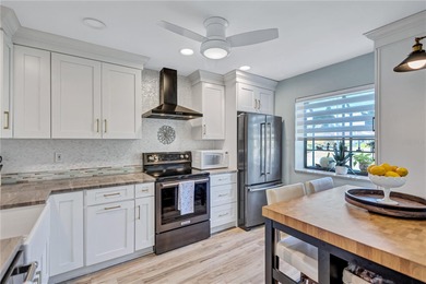 Welcome to this beautifully updated two-bedroom villa in highly on Highland Lakes Executive Golf Course in Florida - for sale on GolfHomes.com, golf home, golf lot