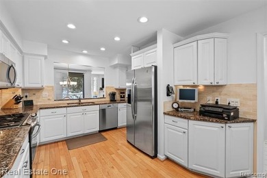 Experience timeless elegance at The Heathers, a prestigious on The Heathers Club in Michigan - for sale on GolfHomes.com, golf home, golf lot