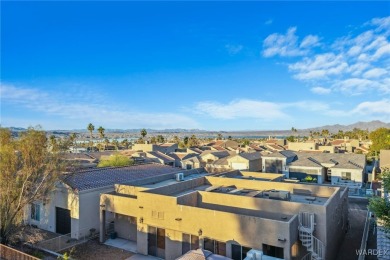 This home is on a quiet cul-de-sac at the edge of the Lake on London Bridge Golf Course in Arizona - for sale on GolfHomes.com, golf home, golf lot