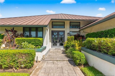 Spectacular location with stunning panoramic golf and water on Pipers Landing Country Club in Florida - for sale on GolfHomes.com, golf home, golf lot