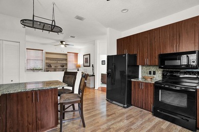 Nestled within Oxford Estates, a charming gated enclave in posh on Boca Lago Golf and Country Club in Florida - for sale on GolfHomes.com, golf home, golf lot