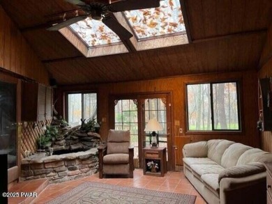 Tanglwood Lakes sprawling home situated on a level wooded lot on Paupack Hills Golf and Country Club in Pennsylvania - for sale on GolfHomes.com, golf home, golf lot
