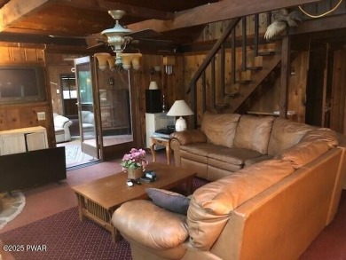 Tanglwood Lakes sprawling home situated on a level wooded lot on Paupack Hills Golf and Country Club in Pennsylvania - for sale on GolfHomes.com, golf home, golf lot
