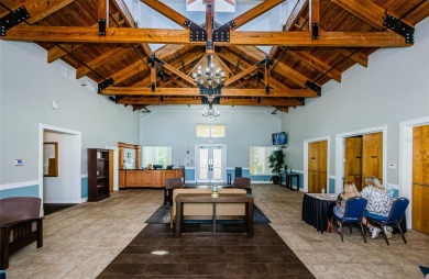 Welcome to this stunning 2-bedroom, plus a den, 2-bath home on Tampa Bay Golf and Country Club in Florida - for sale on GolfHomes.com, golf home, golf lot