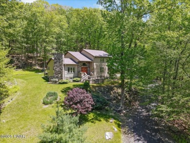 SECLUDED PARADISE in desirable golf community of Tanglwood Lakes on Paupack Hills Golf and Country Club in Pennsylvania - for sale on GolfHomes.com, golf home, golf lot