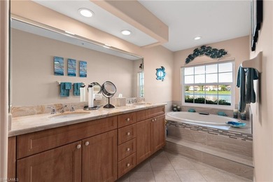 Spectacular lake and golf course views are featured in this on Worthington Country Club in Florida - for sale on GolfHomes.com, golf home, golf lot