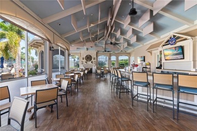 Spectacular lake and golf course views are featured in this on Worthington Country Club in Florida - for sale on GolfHomes.com, golf home, golf lot