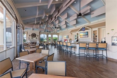 Spectacular lake and golf course views are featured in this on Worthington Country Club in Florida - for sale on GolfHomes.com, golf home, golf lot