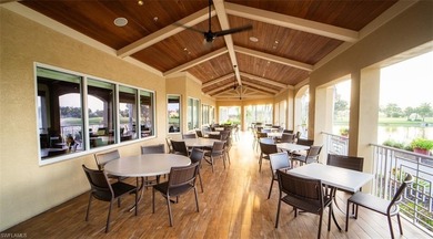 Spectacular lake and golf course views are featured in this on Worthington Country Club in Florida - for sale on GolfHomes.com, golf home, golf lot