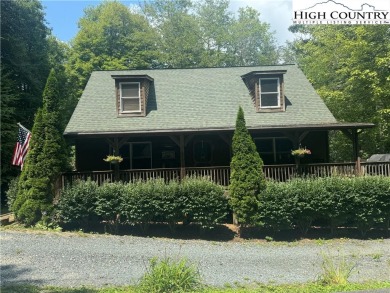 Charming Mountain Cabin located in Linville Land Harbor. This on Land Harbor Golf Course in North Carolina - for sale on GolfHomes.com, golf home, golf lot