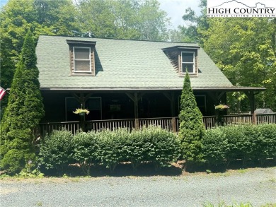 Charming Mountain Cabin located in Linville Land Harbor. This on Land Harbor Golf Course in North Carolina - for sale on GolfHomes.com, golf home, golf lot