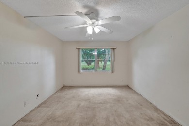 ENJOY ENDLESS GOLF COURSE VIEWS FROM YOUR FIRST FLOOR CONDO WITH on  in Florida - for sale on GolfHomes.com, golf home, golf lot