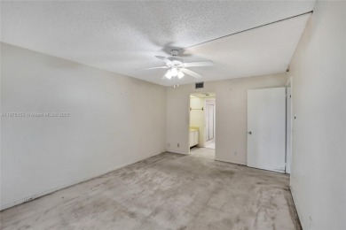 ENJOY ENDLESS GOLF COURSE VIEWS FROM YOUR FIRST FLOOR CONDO WITH on  in Florida - for sale on GolfHomes.com, golf home, golf lot