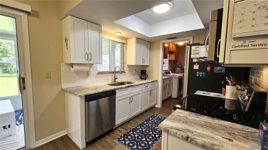 This two-bedroom, two-bathroom home with a two-car garage is on Royal Oaks Golf Club in Florida - for sale on GolfHomes.com, golf home, golf lot