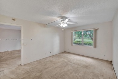 ENJOY ENDLESS GOLF COURSE VIEWS FROM YOUR FIRST FLOOR CONDO WITH on  in Florida - for sale on GolfHomes.com, golf home, golf lot