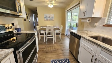 This two-bedroom, two-bathroom home with a two-car garage is on Royal Oaks Golf Club in Florida - for sale on GolfHomes.com, golf home, golf lot